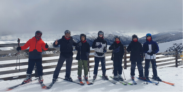 Students and staff on the snow at Ski Camp